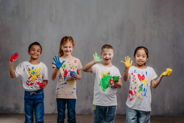 4 children paint hands - Fostering Connections